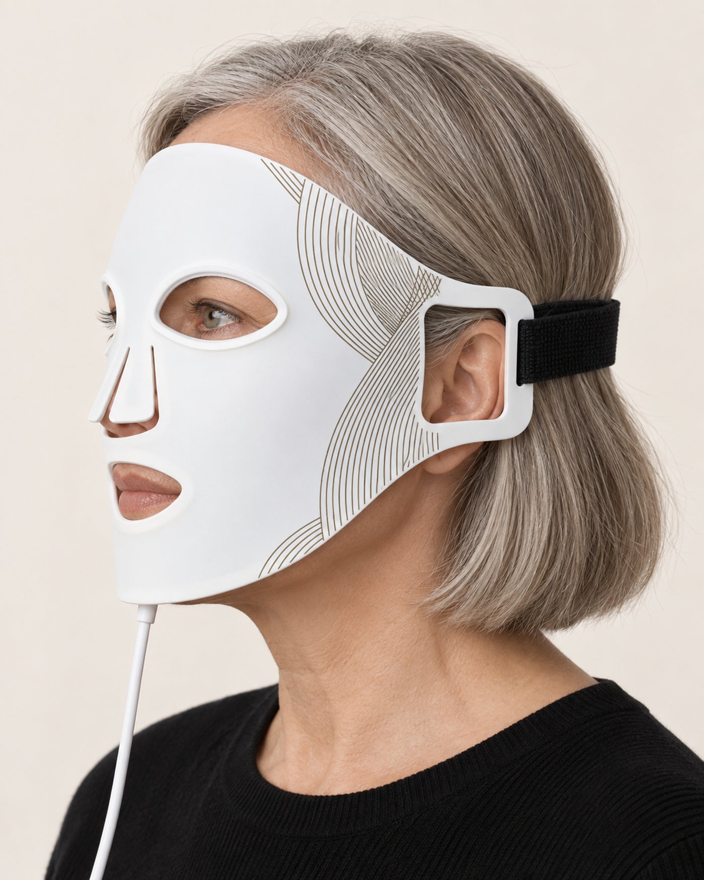 Profile view of a mature woman wearing the unbranded white LED Face Mask